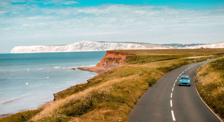 Aerial panoramic view of road with blue car on it with the Needles and sea view. The Isle of WIght, UK
2165386893